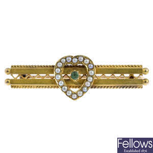 An early 20th century gold gem-set bar brooch.