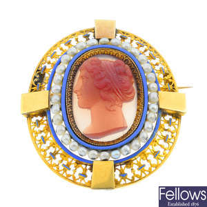 An early Victorian gold cameo brooch with enamel and seed pearls.