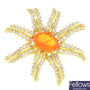 A fire opal and diamond floral brooch.