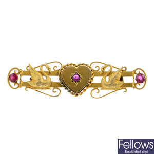 An early 20th century gold garnet-topped-doublet and synthetic ruby brooch.