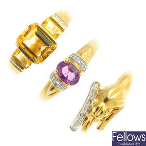 Four 9ct gold gem-set rings and a pair of earrings.