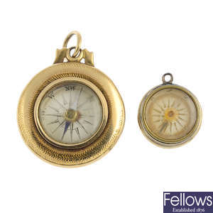 Two early 20th century gold compass charms.