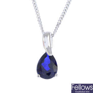 A synthetic sapphire single-stone pendant, with 9ct gold chain.