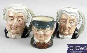 Five Royal Doulton character mugs.