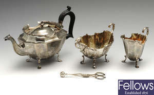 A cased late Victorian silver bachelor three piece tea set and a pair of silver scissor action sugar nips.