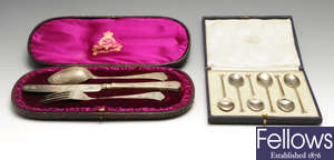 A late Victorian silver christening set, two 1920's cased set of six silver teaspoons, etc.