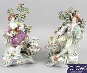 A pair of continental porcelain figure groups.