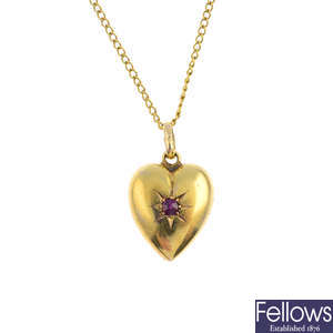 An Edwardian 15ct gold ruby heart pendant, with chain.