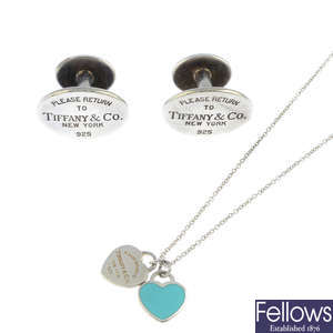 TIFFANY & CO. - an enamel pendant, with chain and a pair of cufflinks.
