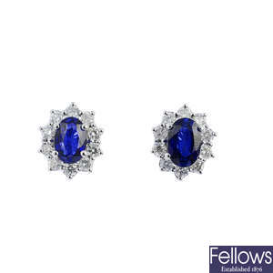 A pair of sapphire and diamond floral cluster earrings.