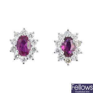 A pair of ruby and diamond floral cluster earrings.