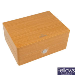 OMEGA - a group of eight watch boxes.