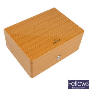 OMEGA - a group of twelve watch boxes.