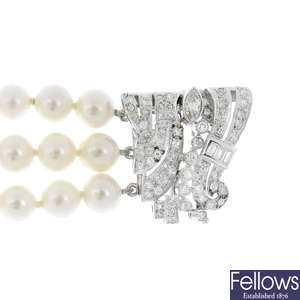 A cultured pearl three-row bracelet with diamond clasp.