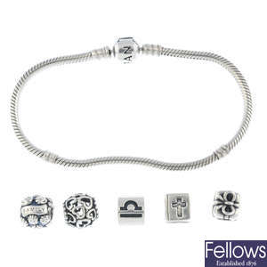 PANDORA - two bracelets and fourteen charms.