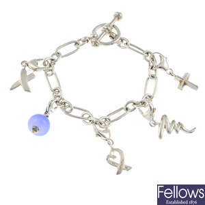 TIFFANY & CO. - a silver charm bracelet.