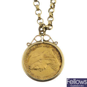 A 9ct gold half sovereign pendant, with 9ct gold chain.