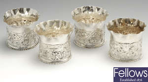 A similarly matched set of four late Victorian silver cup holders.