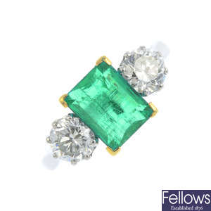 A Colombian emerald and diamond three-stone ring.