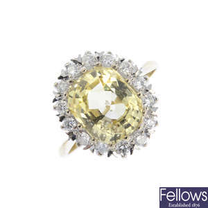 A Ceylon yellow sapphire and diamond cluster ring.
