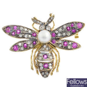 An early 20th century silver and gold ruby, diamond and pearl bee brooch.