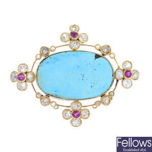 A turquoise, diamond and ruby brooch.