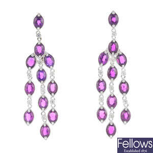A pair of ruby and diamond chandelier earrings.