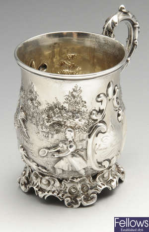 An early Victorian embossed silver christening mug.