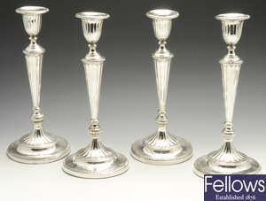 A set of four early twentieth century silver mounted candlesticks by Garrard & Co Ltd.
