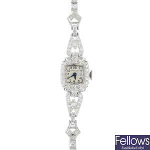 HAMILTON - a lady's mid 20th century platinum diamond cocktail watch.