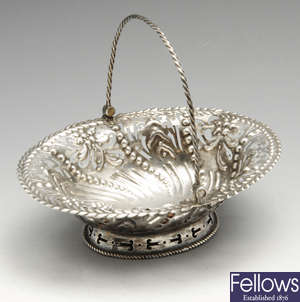 A George III silver swing-handled bonbon dish.