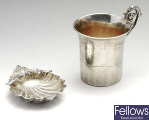 An Italian shell butter dish & an early 19th century French silver-gilt cup. (2).