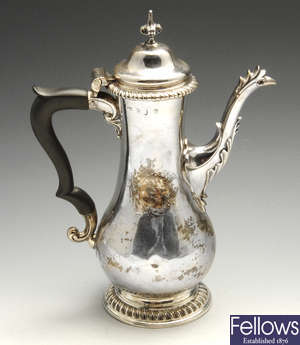An early George III silver coffee pot. 