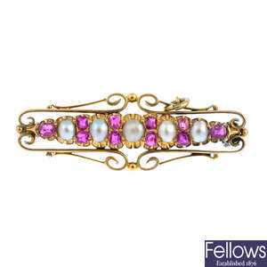 An early 20th century gold ruby and split pearl bar brooch.