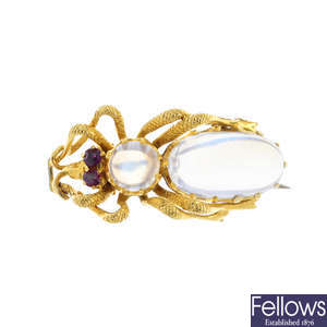 A moonstone and ruby brooch.