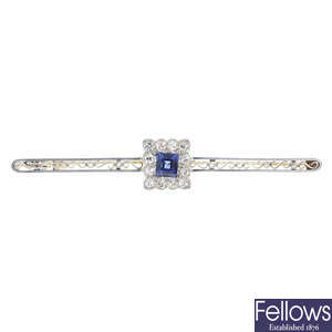 An early 20th century gold sapphire and diamond cluster bar brooch.