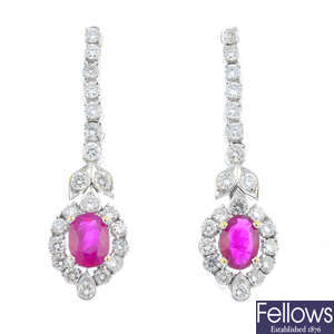 A pair of ruby and diamond drop earrings.