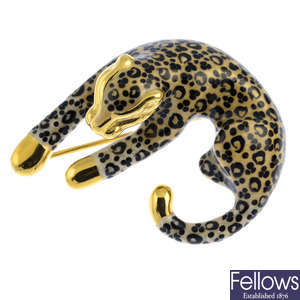 An enamel leopard brooch.