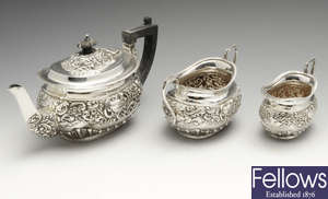 An Edwardian silver three piece bachelor tea service.