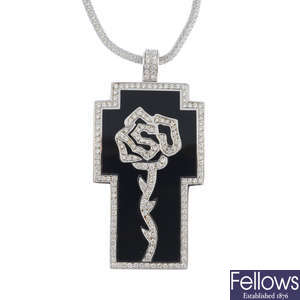 A diamond and black enamel pendant, with chain.