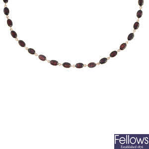 An early 19th century gold garnet necklace.