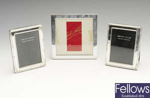 A pair of small modern silver mounted photograph frames & a further singular modern silver mounted photograph frame.