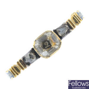An early Georgian gold rock crystal and skull, diamond and enamel mourning ring.