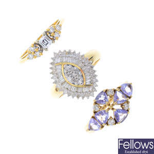 Three gold gem-set dress rings.