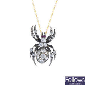 A diamond and ruby spider pendant, with chain.