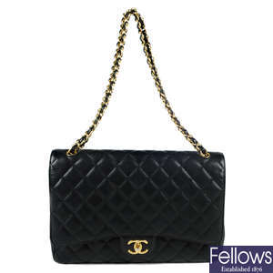 CHANEL - a Caviar Maxi Double Flap handbag.