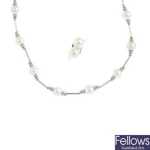A Mikimoto cultured pearl ring and a non-designer cultured pearl necklace.