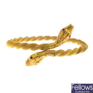 A late Victorian gold serpent torque bangle.