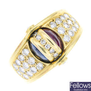 An 18ct gold sapphire, ruby and diamond swivel ring.