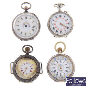 A group of four assorted pocket watch watches.